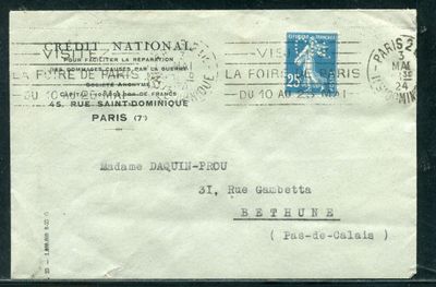 an old envelope with a stamp on it sitting on a table