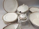 many plates and bowls that are sitting on a table