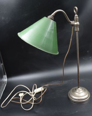 a green lamp that is sitting on a table