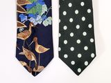 two ties with birds and flowers on them on a white background