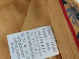 a close up of a label on a yellow jacket