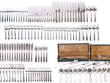 a lot of spoons and forks in a case