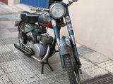 a motorcycle that is parked on the side of the street