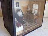 a dog that is sitting in a box on a table