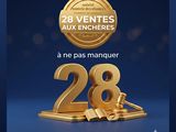 an image of a golden number 28 with the words 28 venttes aux encheres on it