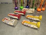 several toothbrushes are lined up on a counter with toothpaste in them