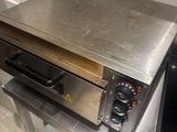 stainless steel counter top with a pizza oven on it
