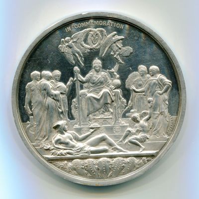 l'image d'une pièce d'argent sur laquelle figure une femme allongée par terre