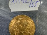 a close up of a gold coin with a label on it
