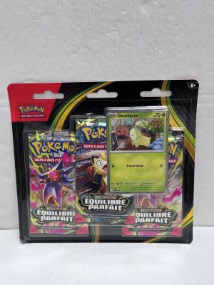 a close up of a box of pokemon cards on a white surface