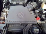a close up of a mercedes engine in a car