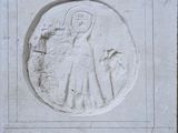a picture of a stone plaque with a picture of a woman