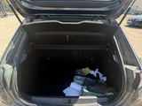 a trunk of a car with a bunch of items in it
