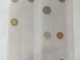 a plastic container with coins in it on a table