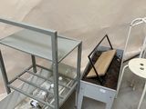 a table with a drawer and a chair next to it