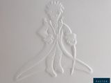 a white drawing of a man and woman on a wall