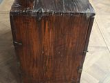 an old wooden box sitting on top of a wooden table