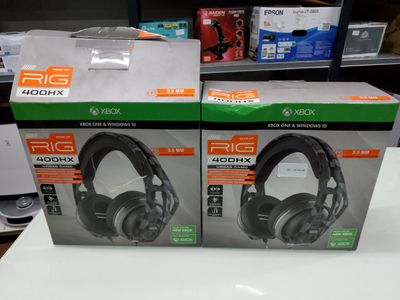 two boxes of headphones on a table in a store