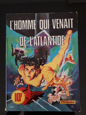 La couverture du livre, *L'homme ou le vent de l'Atlantide*, est