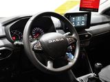 a steering wheel and dashboard of a car with a touch screen