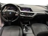 the interior of a car with a steering wheel, dashboard, and dashboard controls