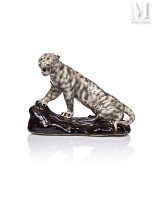 an image of a figurine of a leopard on a log