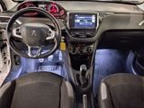the interior of a small car with a steering wheel and dashboard