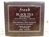 a close up of a box of black tea cream on a table