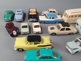 a lot of toy cars that are sitting on a table