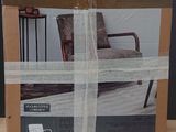 packaging of a bed in a box sitting on a wooden table