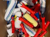 a cardboard box filled with assorted cleaning supplies