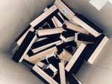 a pile of books sitting in a box on the floor