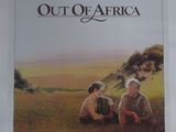an image of a movie poster for out of africa with two men sitting in a field