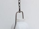 a light that is hanging from a chain on the wall