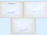 three envelopes with handwritten signatures on them, one of which has been written in blue ink