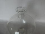 a clear glass vase with a small hole in it