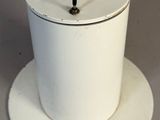 a white blender sitting on top of a white plate