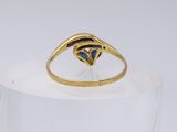 an image of a gold ring with a blue stone in the center