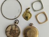 three gold and silver lockes, one with a picture of a woman and one with a ring