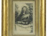 une vieille photo d'un homme barbu dans un cadre en or