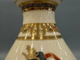 a vase with a picture of a woman on it