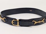 a close up of a black leather belt with gold buckles