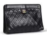 a chanel black quilted leather clutch bag
