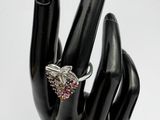 an image of a hand with a ring on it ' s finger