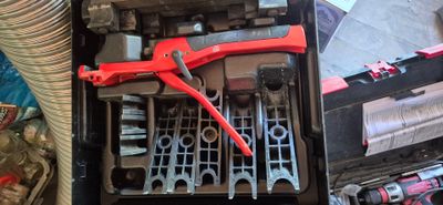 a tool box with tools in it sitting on a table