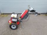 a small machine that is sitting in the dirt