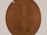 brown paper plate with a cross cut out of it sitting on a table