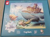 the puzzle box has a picture of a mermaid and a whale