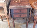 a small table with a drawer on top of it next to a small table with a drawer on top of it