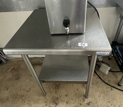 a small table that has a machine on top of it